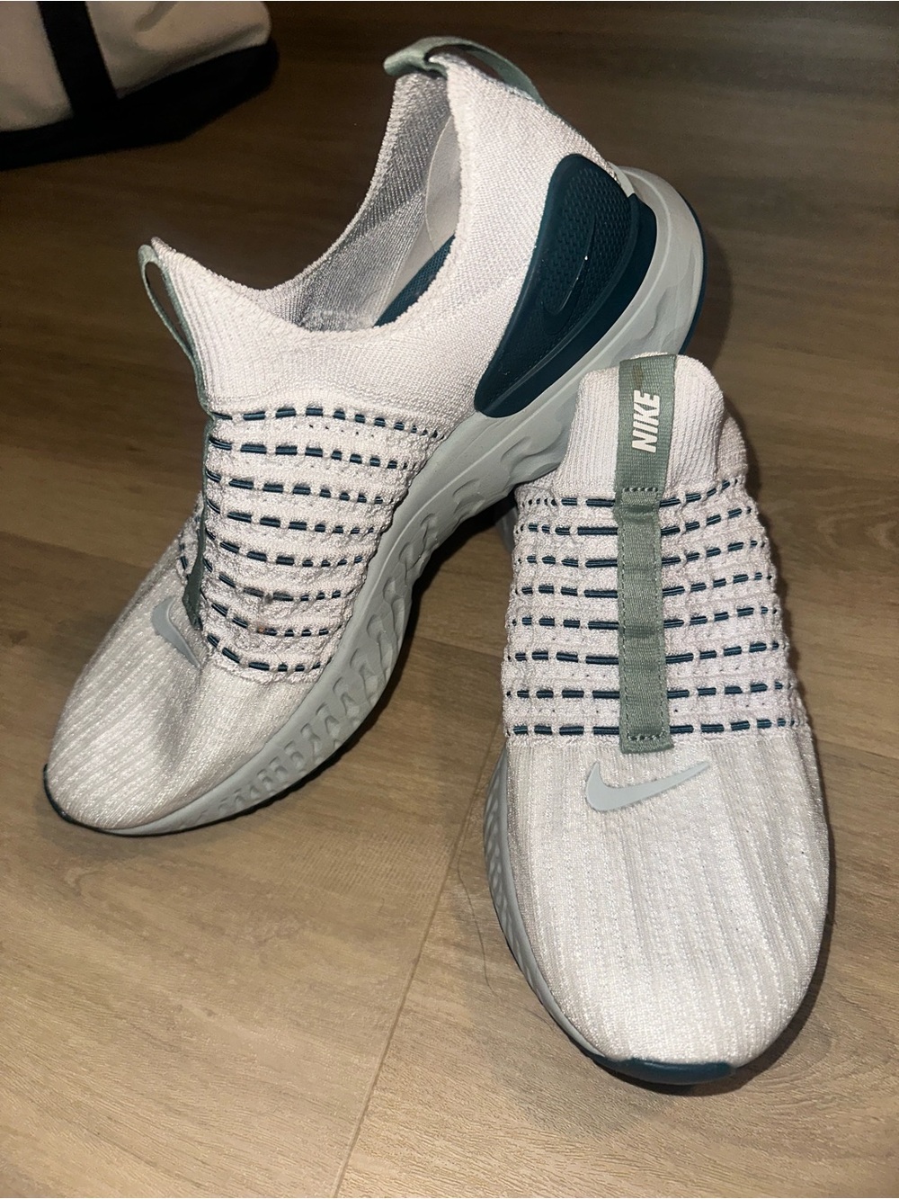 Nike Women’s White Knit Slip-On Sneakers with Teal and Gray Accents